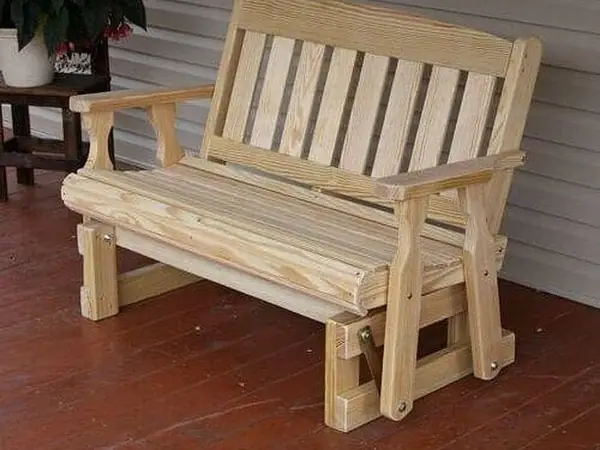 Wooden glider bench on a porch